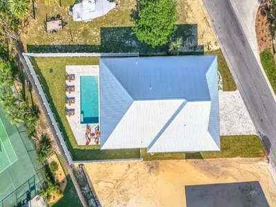 an overhead view of a house with a blue roof at Coastal Breeze in Panama City Beach