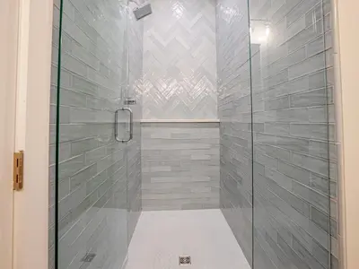 a shower with a glass door in a bathroom at Coastal Breeze in Panama City Beach