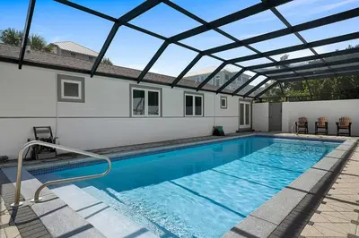 a swimming pool with a pergola over it at Gulf Escape - 30A Beach House Near the Beach with a Large Pool Space in Inlet Beach