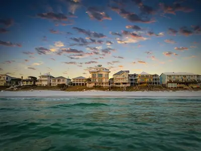 a group of houses on a beach with the ocean at Sea Grove - Beachfront, Ocean Views & Balcony in Santa Rosa Beach