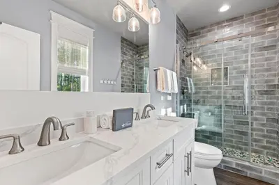 a white bathroom with a sink and a toilet at 30A Pet Friendly Beach House - Scissortrail at Treetops in Seacrest