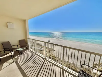 a balcony with a view of the beach at Beachfront Studio with Bunks Sleeps 4 at Majestic! in Panama City Beach