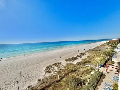 an overhead view of a beach with people on it at Beachfront Studio with Bunks Sleeps 4 at Majestic! in Panama City Beach