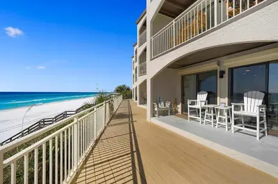 a balcony of a house with a view of the beach at Dune Villas 2A - Gulf Front Vacation Condominium with Shared Pool in Santa Rosa Beach