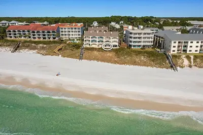 an aerial view of a beach with buildings and the ocean at Dune Villas 2A - Gulf Front Vacation Condominium with Shared Pool in Santa Rosa Beach