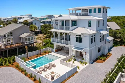 an aerial view of a house with a swimming pool at Pompano Paradise - 30A Vacation House with Ocean Views, Private Pool & Golf Cart in Rosemary Beach