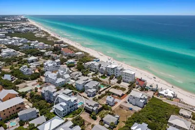 an aerial view of a beach with houses and the ocean at Pompano Paradise - 30A Vacation House with Ocean Views, Private Pool & Golf Cart in Rosemary Beach