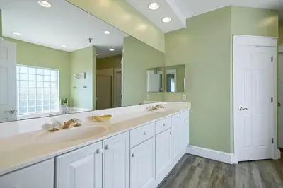 a bathroom with two sinks and a large mirror at Seaview 1 Unit 300 - Gulf Front Condo on 30A & Ocean Views in Santa Rosa Beach