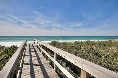 a wooden pathway to the beach with the ocean at Seaview 1 Unit 300 - Gulf Front Condo on 30A & Ocean Views in Santa Rosa Beach