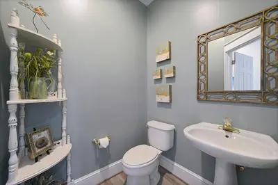 a bathroom with a sink and a toilet and a mirror at Seaview 1 Unit 300 - Gulf Front Condo on 30A & Ocean Views in Santa Rosa Beach