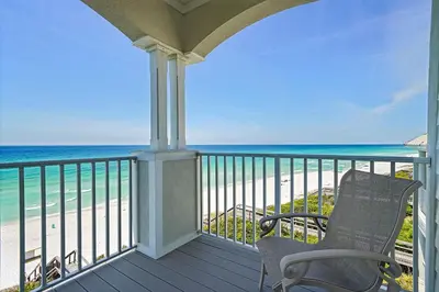 a balcony with a chair and the beach at Seaview 1 Unit 300 - Gulf Front Condo on 30A & Ocean Views in Santa Rosa Beach