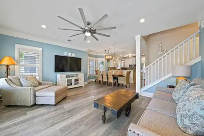 a living room with a couch and a table at Southern Charm - Luxury Vacation Rental Near the Beach with Community Pool & Amenities in Seacrest