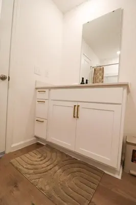 a bathroom with a white vanity with a mirror at Cozy 4BR Panama City Retreat! Games & Beach Gear! in Panama City
