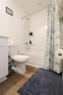 a bathroom with a toilet and a tub and a sink at Cozy 4BR Panama City Retreat! Games & Beach Gear! in Panama City