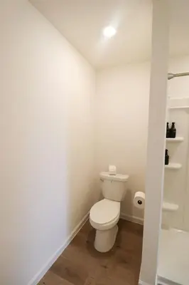a bathroom with a white toilet in a room at Cozy 4BR Panama City Retreat! Games & Beach Gear! in Panama City
