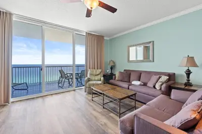 a living room with a couch and a table at Palazzo Beach Resort by Panhandle Getaways in Panama City Beach