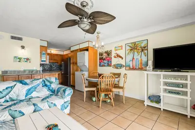 a living room with a couch and a table at Summit 1417 Beach Resort - Amazing Balcony Views in Panama City Beach
