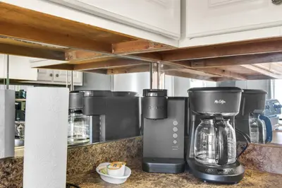 a coffee maker on a counter in a kitchen at Summit 807 Beach Resort - Amazing Balcony Views in Panama City Beach