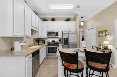 a kitchen with white cabinets and a counter top at 30A-Sea La Vie-Seagrove Highlands 2302 in Santa Rosa Beach