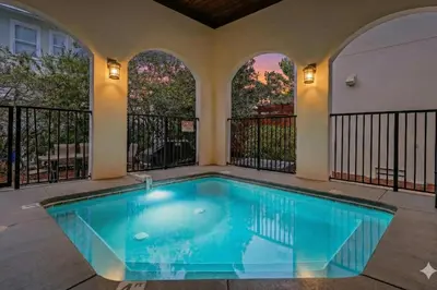 a swimming pool in the middle of a house at Villa Palmeira in Santa Rosa Beach