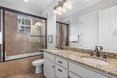 a bathroom with two sinks and a shower at Villa Palmeira in Santa Rosa Beach