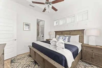 a bedroom with a bed with two teddy bears on it at Rhema Luxury Beach Haus 2BR 2B ResortPool with optional 6-seater GolfCart & 4Bikes in Inlet Beach