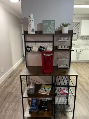 a shelf with items on it in a room at Renovated Townhome by the Bay in Panama City