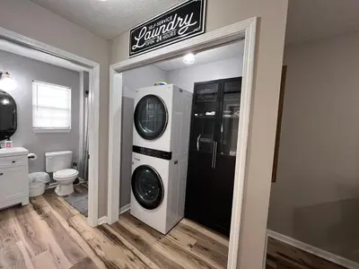 a laundry room with a washer and dryer in it at First Cast in Panama City Beach