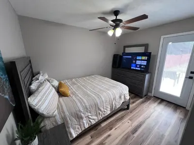 a bedroom with a bed and a ceiling fan at First Cast in Panama City Beach