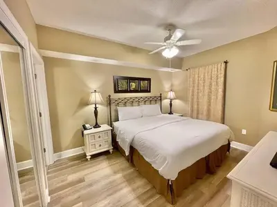 a bedroom with a bed and a ceiling fan at Majestic Beach Towers 2-2107 by Emerald Coast Retreats in Panama City Beach
