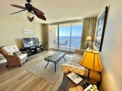a living room with a view of the ocean at Majestic Beach Towers 2-2107 by Emerald Coast Retreats in Panama City Beach