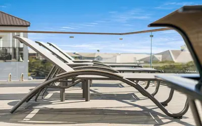 a group of chairs sitting on a patio at Magnolia Way in Santa Rosa Beach