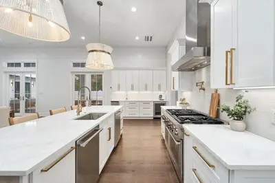 a kitchen with white counters and a stove top oven at Gulfside Hideaway in Santa Rosa Beach