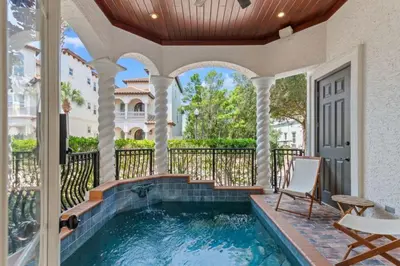 a house with a swimming pool and a porch at Poseidon's Grotto in Santa Rosa Beach