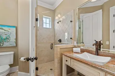 a bathroom with a sink and a shower at Poseidon's Grotto in Santa Rosa Beach