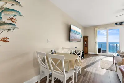 a dining room with a table and chairs at Gulf-View Resort Condo with Pools & Beach Access by Dolce Vita Getaways in Panama City Beach