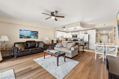 a living room with a couch and a table at Gulf-View Resort Condo with Pools & Beach Access by Dolce Vita Getaways in Panama City Beach