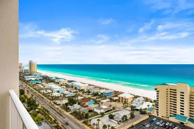 a view of the beach from the balcony of a condo at Gulf-View Resort Condo with Pools & Beach Access by Dolce Vita Getaways in Panama City Beach
