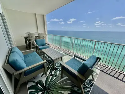 a balcony with chairs and a view of the ocean at Ocean Reef 2203 by Emerald Coast Retreats in Panama City Beach