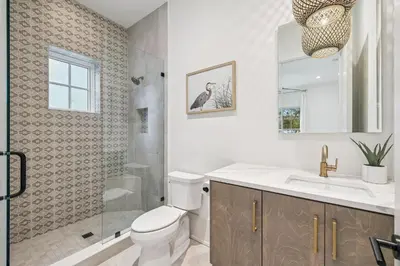 a bathroom with a toilet and a shower and a sink at Katydid Beach Bungalow by 30A Escapes in Seagrove Beach