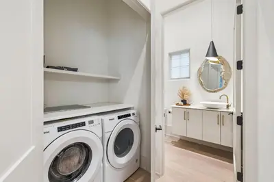 a white laundry room with a washer and dryer at Katydid Beach Bungalow by 30A Escapes in Seagrove Beach