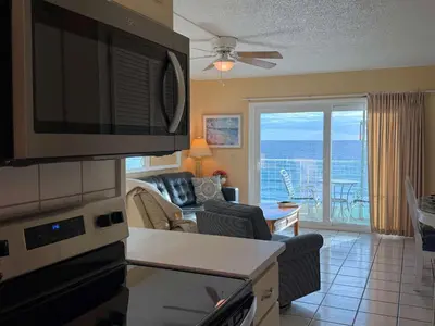 a living room with a view of the ocean at The Summit 830 - Ocean Front Condo in Panama City Beach