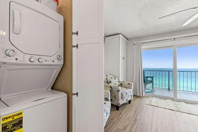 a living room with a view of the ocean at The Summit 1419 - Gulf View Escape in Panama City Beach