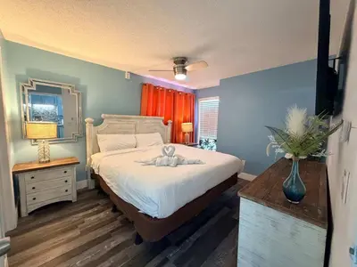 a bedroom with a bed with a teddy bear on it at The Summit 1132 - Beachfront Bliss Stunning 2BR in Panama City Beach