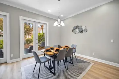 a dining room with a table and chairs at Beach Access - Pool - Game Room - Pets - BBQ Grill in Panama City Beach