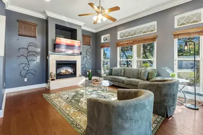 a living room with a couch and a fireplace at Walk to the Beach - BBQ - Patio - Play Area - Pets in Panama City Beach