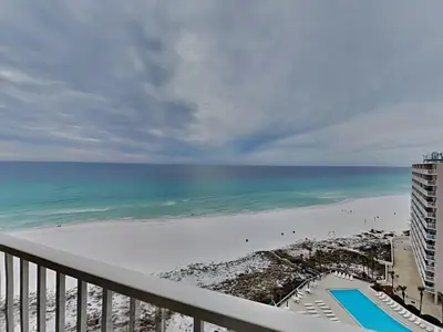 a view of the beach from the balcony of a condo at Dunes of Panama #E1405 in Panama City Beach