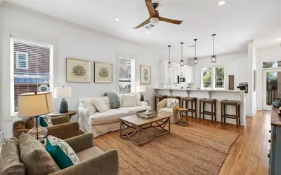 a living room with a couch and a table at A Villa La La in Santa Rosa Beach