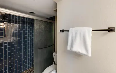 a bathroom with a toilet and a towel on a rack at Beachcrest 202 in Santa Rosa Beach