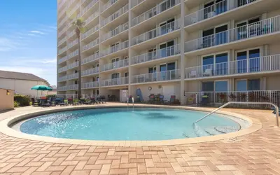 a swimming pool in front of a hotel at Beachcrest 202 in Santa Rosa Beach